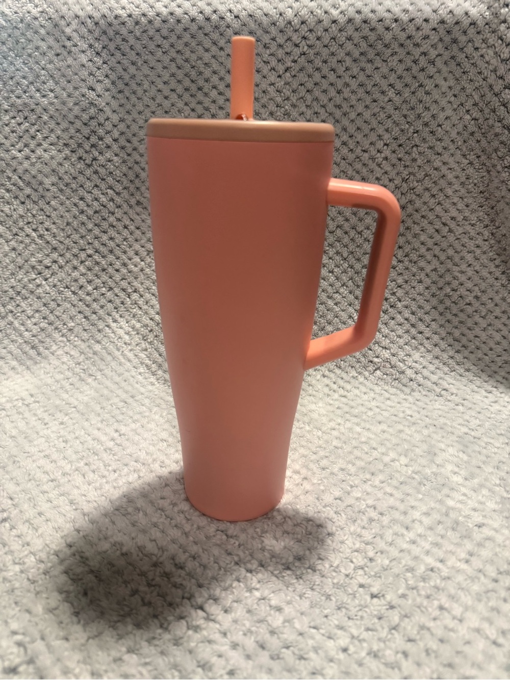 Light orange almost creamsicle color brumate Tumbler with Handle and Straw